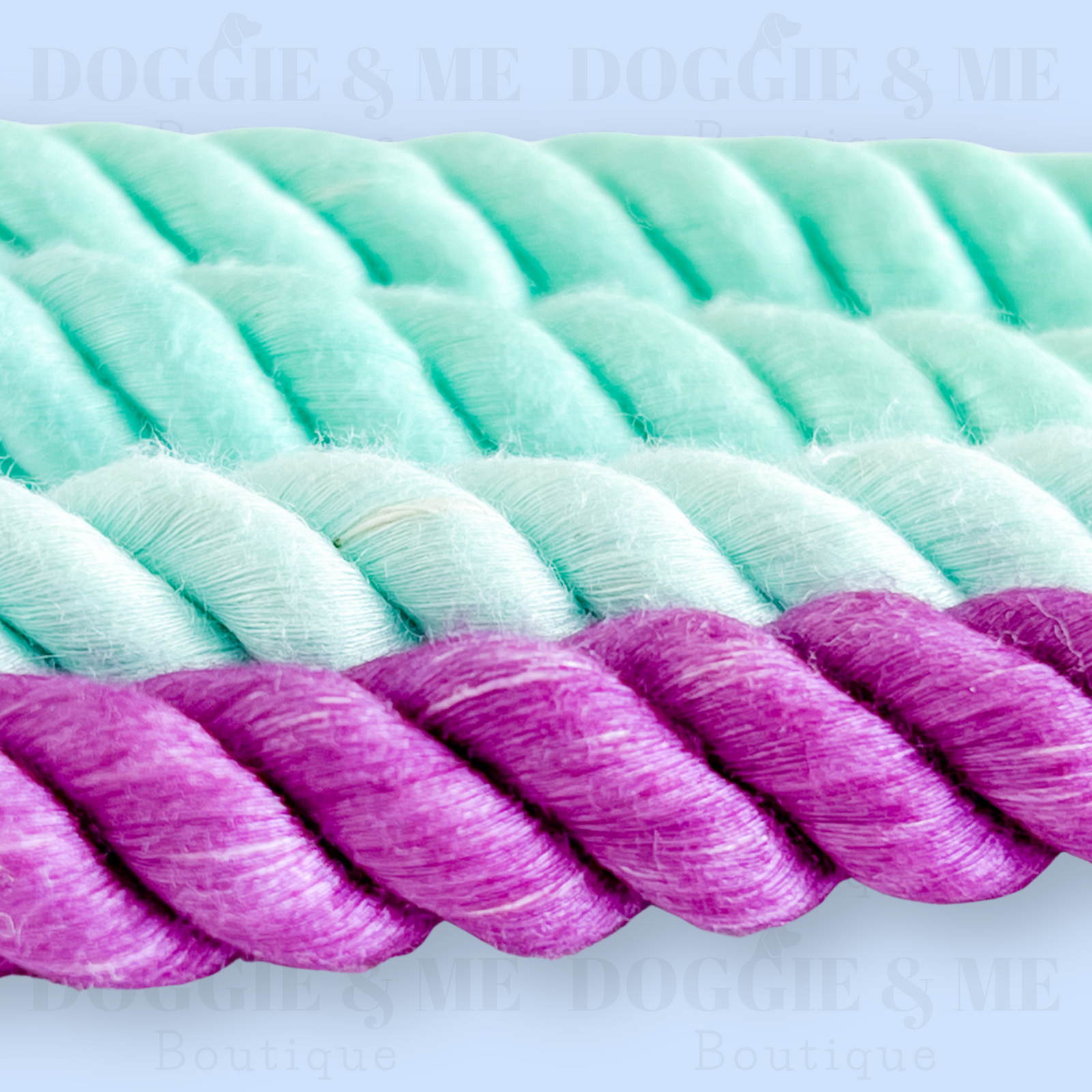 Close-up of a braided ombre turquoise-purple cotton dog leash with tan leather joints, showcasing its soft yet durable texture and gold snap hook. Available in various colors and lengths from 4ft to 5.74ft.