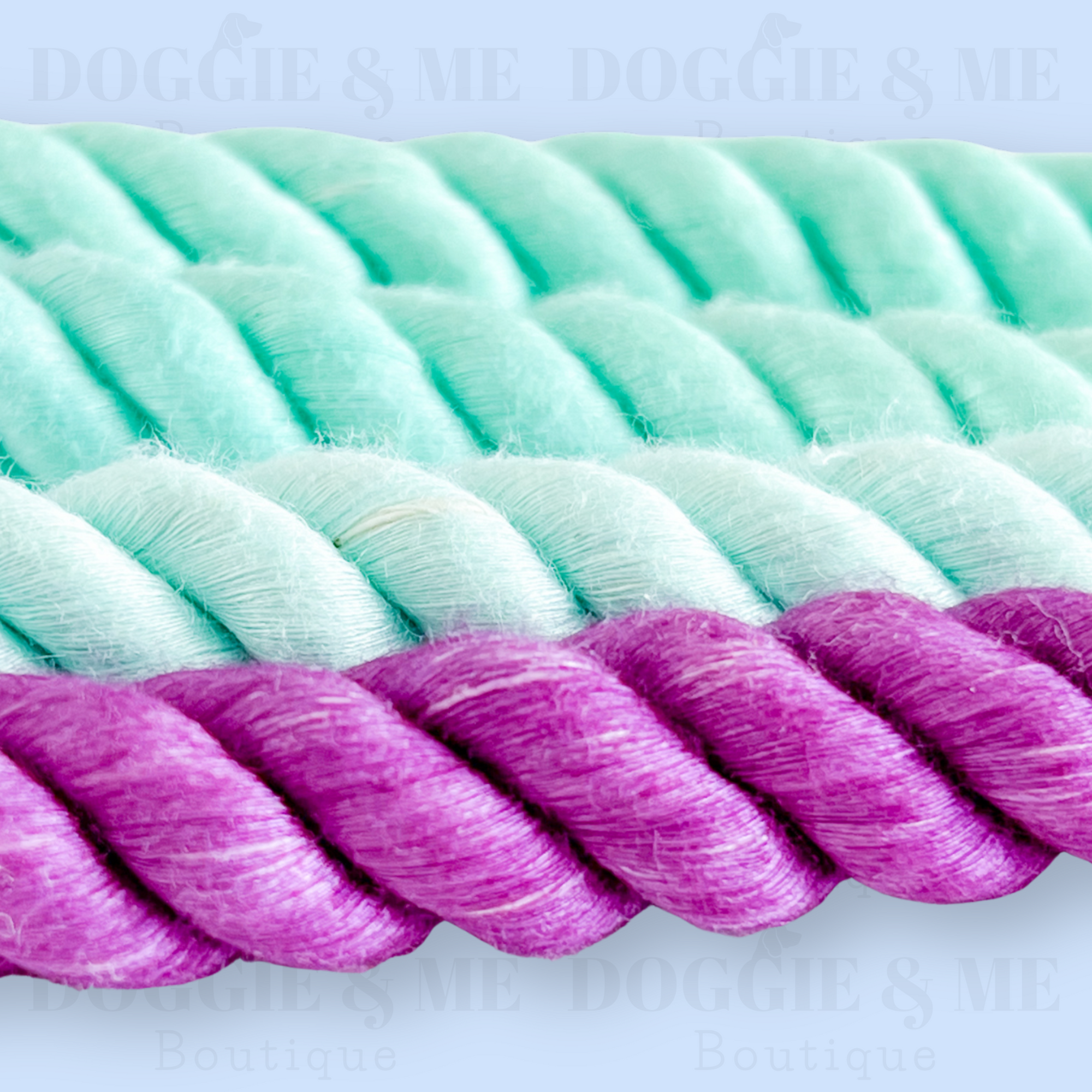 Close-up of a braided ombre turquoise-purple cotton dog leash with tan leather joints, showcasing its soft yet durable texture and gold snap hook. Available in various colors and lengths from 4ft to 5.74ft.