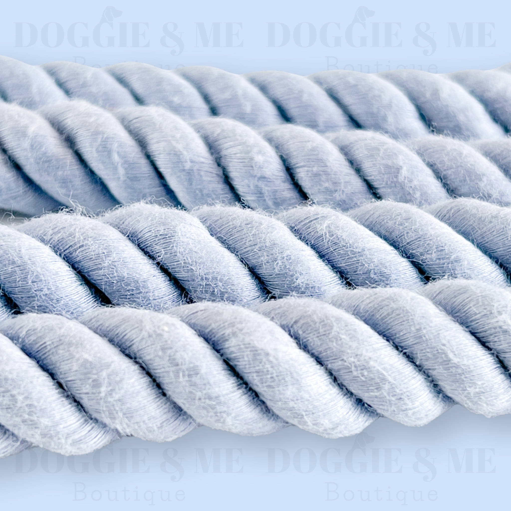 Close-up of a braided blue cotton dog leash with tan leather joints, showcasing its soft yet durable texture and gold snap hook. Available in various colors and lengths from 4ft to 5.74ft.