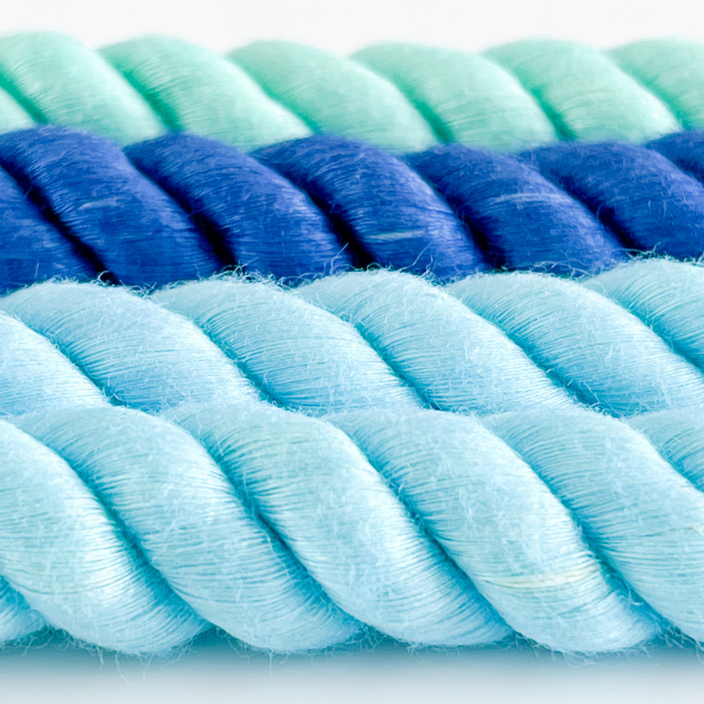 Close-up of a blue and green rope on a white background