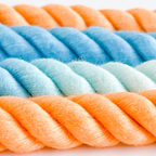 Close-up of multicolored rope with blue, green, and orange hues.